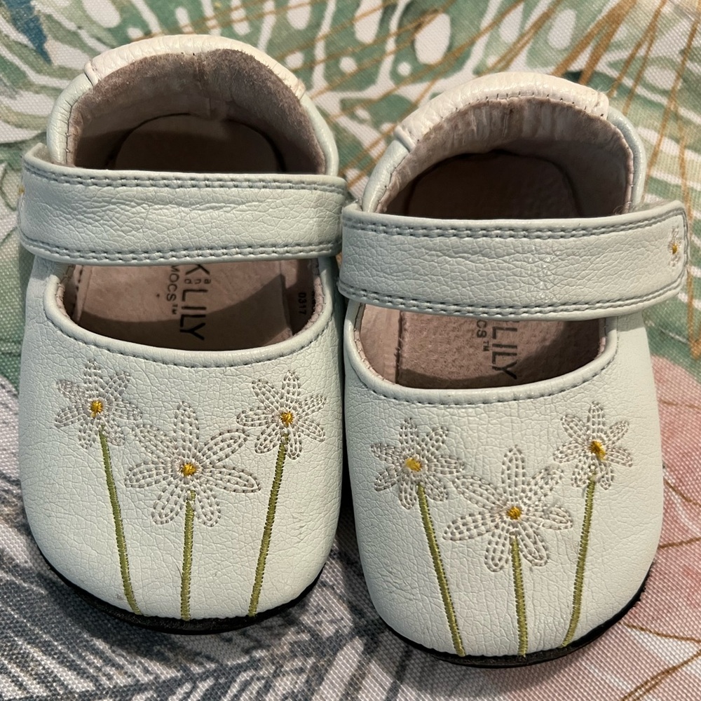 Jack & Lily My Mocs light blue and white and embroidered daisies leather shoes